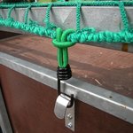 Hook metal with elastic loop for trailer net